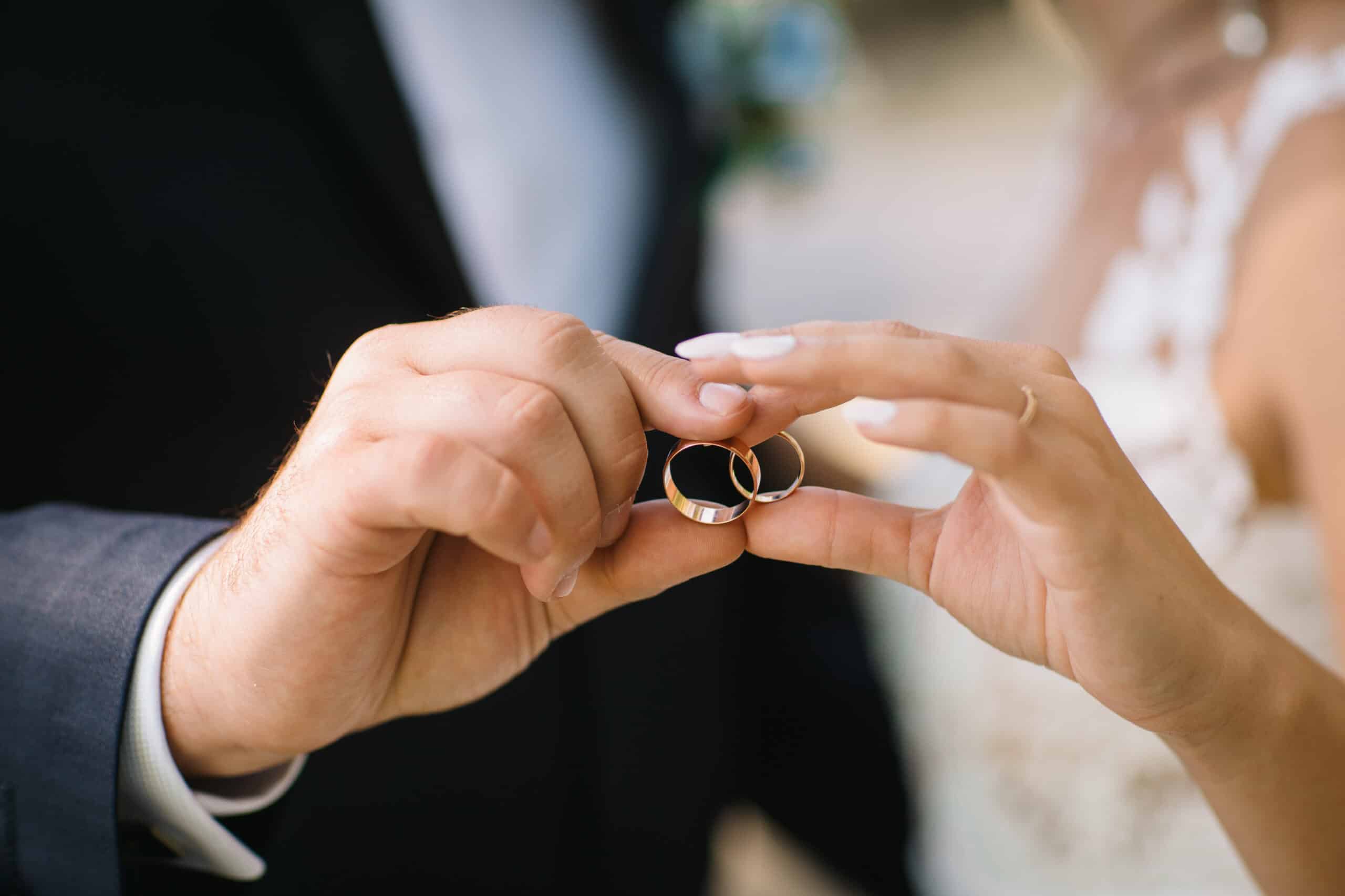 holding wedding rings